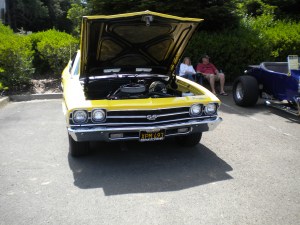 In this picture, it is easy to notice how low the engine is.  It's that way so it lowers the center of gravity.  It also kills the suspension.  