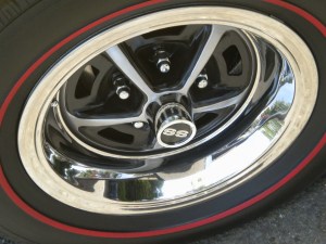 If you look closely, you'll notice that there are disc brakes hiding behind that wheel.  That's the rear wheel.  The El Camino was so fast that it needed discs at all four corners to stop it.  Barely.