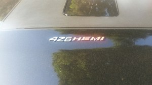 Man, this is just one of THE best engines in the world!  Let me tell you a funny story about this car and another car.  Somebody in a 1949 Chevy lowrider tried to do a burnout.  All he did was send a bunch of smoke out of his tailpipes.  The owner of this fine triple-black '71 Charger proceeded to do a burnout without really having to try too terribly hard right through an empty intersection!  